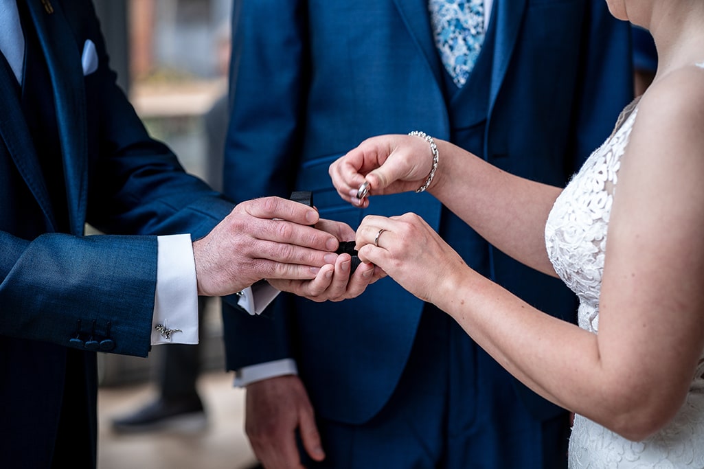 Close up of rings being exchanged during Vicky and Ants marriage vow ceremony