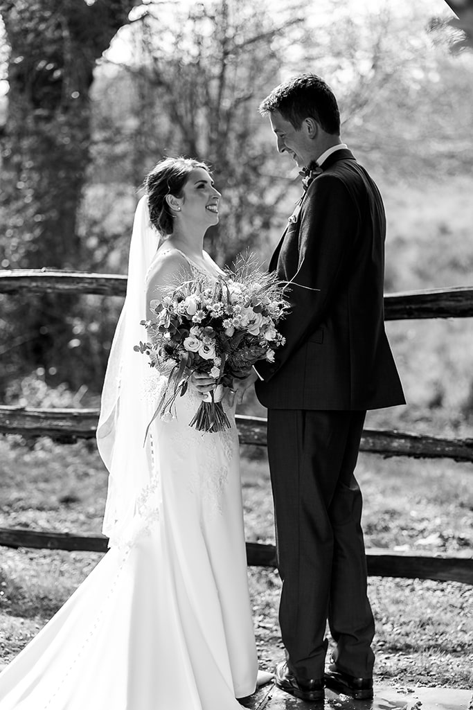 Stylish black and white photo of bride (Vicky) and groom (Ant) looking adoringly at one another